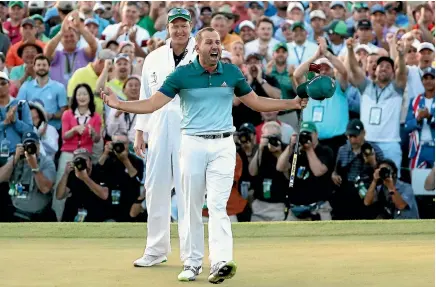  ?? PHOTO: GETTY IMAGES ?? Sergio Garcia celebrates with caddie Glen Murray after winning the Masters in a playoff with Justin Rose yesterday.