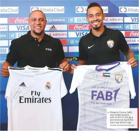  ?? Courtesy: Abu Dhabi Sports Council ?? Roberto Carlos (left) exchanges jerseys with Al Ain’s Caio at a promotiona­l event for the Club World Cup.