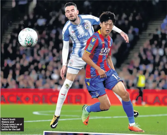  ??  ?? Town’s Scott Malone and Chung-yong Lee of Crystal Palace battle for the ball