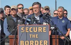  ?? ERIC GAY/AP ?? House Speaker Mike Johnson stands with Republican members of Congress, on Wednesday in Eagle Pass, Texas, on a visit to the U.S./Mexico border.