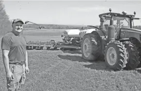  ?? MIKE SCHENK/THE-DAILY-RECORD.COM ?? Bruce Tate stands next to his 16-row high-speed corn planter. On a good day, he can plant over 400 acres.