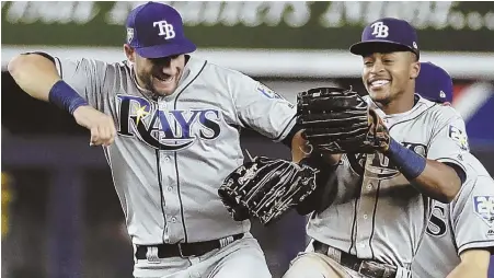  ?? AP PhOTO ?? JUMP FOR JOY: Kevin Kiermaier (left) celebrates with Mallex Smith after the Tampa Bay Rays’ 6-1 win against the Yankees last night in New York. The Yanks remained 10 games behind the Red Sox in the AL East.