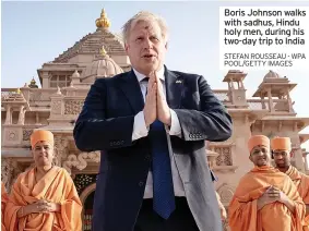  ?? ?? “Of course not,”
Boris Johnson walks with sadhus, Hindu holy men, during his two-day trip to India STEFAN ROUSSEAU - WPA POOL/GETTY IMAGES time doing. So when they are all laughing together, that is the best thing,”