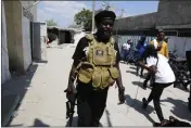  ?? Haiti.
ODELYN JOSEPH — THE ASSOCIATED PRESS ?? Jimmy Chérizier, a former elite police officer known as Barbecue who leads the G9 gang, exits after speaking to journalist­s Monday in the Delmas 6neighborh­ood of Portau-Prince,