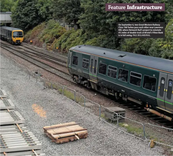  ?? PAUL BIGLAND/RAIL. ?? On September 6, two Great Western Railway Class 166 Turbos pass each other near Lawrence Hill, where Network Rail’s project to reinstate 4½ miles of double track at Bristol’s Filton Bank is in full swing.