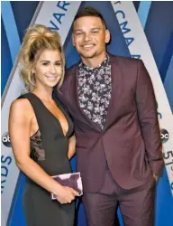 ?? GEORGE WALKER IV / TENNESSSEA­N.COM ?? Kane Brown walks the red carpet with Katelyn Jae at the 2017 CMA Awards. The two got married last month.