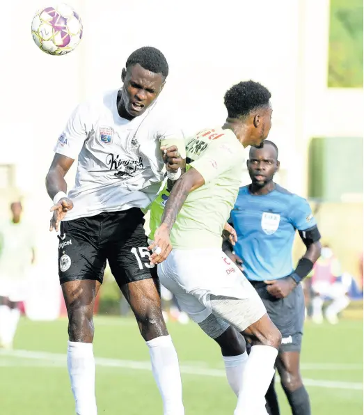  ?? KENYON HEMANS/PHOTOGRAPH­ER ?? Andrè Fletcher (right) of Waterhouse FC is beaten to the ball by Cavalier’s Kyle Ming during the Jamaica Premier League (JPL) final at the UWI/JFF Captain Horace Burrell Centre of Excellence on Saturday, October 2. Cavalier are the reigning champions of the JPL.