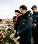  ?? NATALIA KOLESNIKOV­A/AFP ?? Russian emergency cadets visited a memorial in front of the concert venue where 139 people were killed.