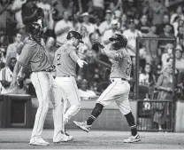  ?? Karen Warren / Staff photograph­er ?? Jose Altuve, right, celebrates with Jose Siri, left, and Alex Bregman after his two-run shot in the sixth inning off Diamondbac­ks starter Madison Bumgarner. It was the only hit Bumgarner surrendere­d in seven innings.