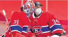  ?? ERIC BOLTE-USA TODAY SPORTS ?? Montreal Canadiens starting goalie Carey Price, left, and backup Jake Allen chat after their game against the Ottawa Senators at the Bell Centre in Montreal on Tuesday.