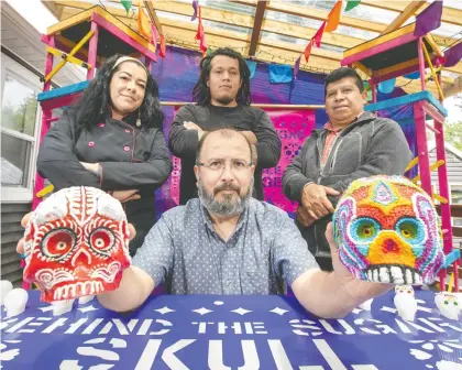  ?? GREG SOUTHAM ?? As part of his exploratio­n of Mexico's famous sugar skulls, Fernando Cienfuegos will share details of the craft along with Araceli Lopez. Brandon Rodriguez de Paz and Angel Mejia at a Milner library event.