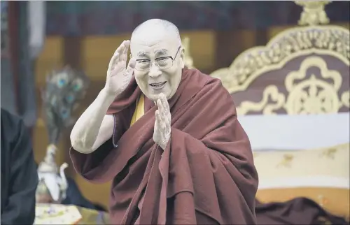  ?? PICTURE: AP. ?? BEIJING PROTEST: Tibetan spiritual leader the Dalai Lama greets devotees at the Buddha Park in Bomdila, Arunachal Pradesh, India, yesterday.