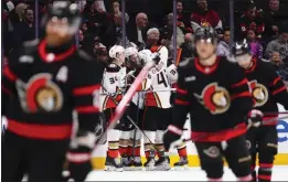  ?? SEAN KILPATRICK — THE CANADIAN PRESS VIA AP ?? The Ducks celebrate the first of Mason McTavish’s two goals against the Senators in the second period Thursday at Ottawa. McTavish also scored in the third period.