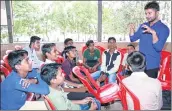  ??  ?? Sagar Reddy talking to some of his wards