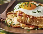  ?? TOM MCCORKLE — FOR THE WASHINGTON POST ?? Cheesy Ham Bake with Spicy Fried Eggs