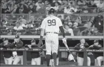  ?? Andrew Mills /TNS ?? Newyorkyan­kees center fielder Aaron Judge (99) walks back to the dugout after he was stranded on third base after leading off against the Boston Red Sox with a double on Sept. 25.