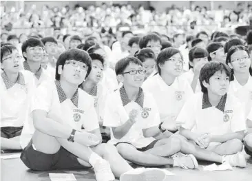  ??  ?? Moment of truth: St Hilda’s Primary School pupils waiting anxiously for their PSLE results to be announced. — The Straits Times / Asia News Network