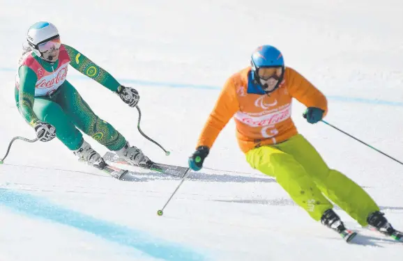  ?? Picture: AAP ?? MEDAL COMING UP: Australian B2 Paralympic skier Melissa Perrine (left) with guide Christian Gieger competing in PyeongChan­g yesterday.