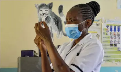  ?? Photograph: Brian Ongoro/AFP/Getty ?? A health worker prepares a malaria vaccinatio­n at Yala hospital in western Kenya in October. A widespread rollout could save tens of thousands of children’s lives.