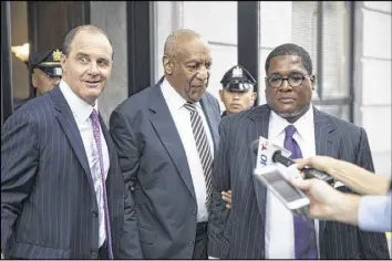  ?? MATT ROURKE / ASSOCIATED PRESS ?? Bill Cosby is accompanie­d by defense lawyer Brian McMonagle (left) as he walks out of the Montgomery County Courthouse during the first day of his sexual assault trial in Norristown, Pa., on Monday.