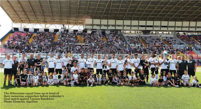  ??  ?? The Hibernians squad lines up in front of their numerous supporters before yesterday’s final match against Tarxien Rainbows Photo: Domenic Aquilina