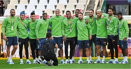  ?? — AFP ?? Who can it be now?: brazil players pose for a photograph during a familiaris­ation session at the Lusail stadium.