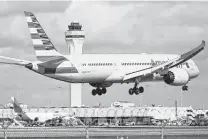  ?? Joe Raedle / Getty Images ?? American Airlines has already hired 16,000 employees this year, including 1,350 pilots and more than 1,600 flight attendants.