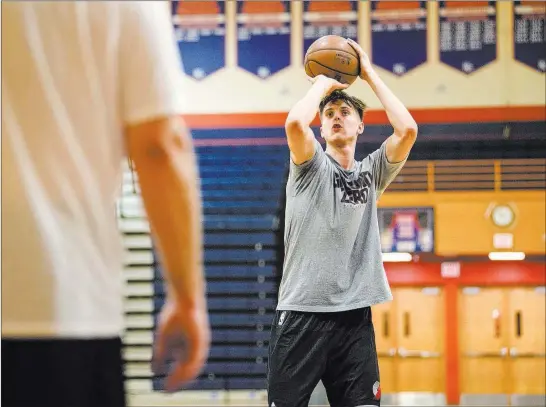  ?? Morgan Lieberman ?? Las Vegas Review-journal Portland Trail Blazers rookie Zach Collins works out at his alma mater, Bishop Gorman High School, in advance of NBA Summer League play, which begins Friday.