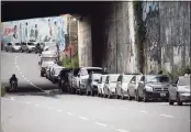  ?? Associated Press file photo ?? Vehicles line up near a gas station to fill their tanks in Caracas, Venezuela, in September. Maritime safety mechanisms have become a powerful mechanism for tracking ships engaged in rogue activities like transporti­ng sanctioned crude oil to and from places under U.S. or internatio­nal sanctions like Venezuela.