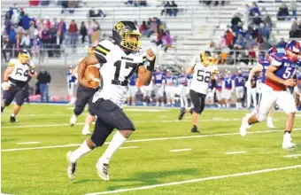  ?? STAFF PHOTO BY MATT HAMILTON ?? McMinn County (17) Jalen Hunt bursts into the open during a game against Cleveland on Oct. 16. Hunt rushed 25 times for 292 yards and five touchdowns against rival Bradley Central this past Friday.