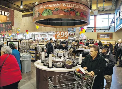  ?? BRIAN THOMPSON/FILES ?? Ottawa-based Farm Boy’s newer stores have a restaurant-inspired design with seating areas and chefs cooking inside the store. Such so-called “grocerants” are becoming more ubiquitous as the fastest-growing meal segment last year was ready-prepared meals.