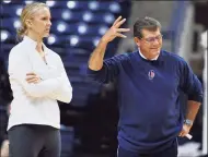  ?? Jessica Hill / Associated Press ?? UConn coach Geno Auriemma, right, gestures as assistant coach Shea Ralph watches practice before the team’s media day in 2012.