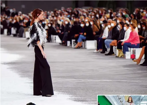  ?? Getty Images ?? A model walks for Chanel’s COVID-aware show at Paris Fashion Week.