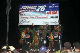  ?? RICH KEPNER - FOR DIGITAL FIRST MEDIA ?? Top 3 finishers Ryan Godown, left, Duane Howard, center, and Craig Von Dohren pose in victory lane after the Freedom 76 on Sept. 15 at Grandview Speedway, Howard took home the top prize and the $25,000 win.