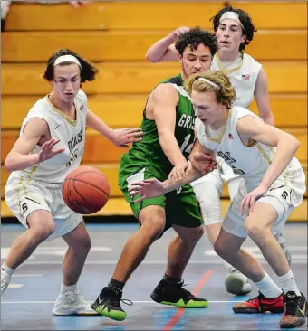  ?? SEAN D. ELLIOT/THE DAY ?? Stonington’s Tyler Fidrych, left, and Zach Scott force a turnover on Griswold’s Pharaoh Curtis during Saturday’s ECC Division II boys’ basketball tournament semifinal at Waterford High School. The No. 2 Bears won 42-39. Visit www.theday.com to view a photo gallery.