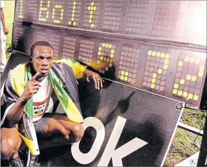  ??  ?? Usain Bolt celebrates his 100m world record at Icahn Stadium, in New York City on May 31, 2008