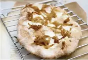  ?? HILLARY LEVIN St. Louis Post-Dispatch ?? Homemade flatbreads with creative toppings, like this Caramelize­d Onions and Fontina Flatbread.