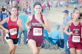  ??  ?? Siloam Springs junior Brittany Pilcher, middle, finished 13th overall with a time of 21:39.7 on Friday at the Class 6A cross country meet at Oaklawn Park in Hot Springs.