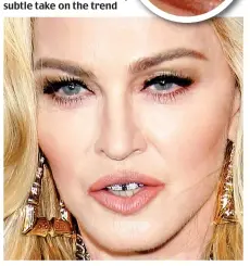  ?? ?? Material grill: Madonna is no stranger to courting controvers­y, and owns thousands of pounds worth of sparkling face jewellery