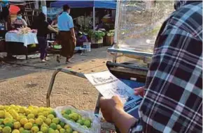  ?? AFP PIC ?? A copy of an undergroun­d newsletter that was distribute­d at a market in Yangon recently.