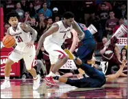  ?? NWA Democrat-Gazette/SPENCER TIREY ?? Arkansas Razorbacks guard Anton Beard (31) steals the ball from Samford’s Christen Cunningham as teammate Trey Thompson prepares to run the fast break Friday night at Walton Arena in Fayettevil­le. The Razorbacks opened the season with a 95-56 victory.