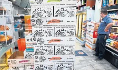  ?? TIMOTHY A. CLARY AFP VIA GETTY IMAGES FILE PHOTO ?? Sales data from market research firm Nielsen IQ recently showed that even White Claw, the market leader in hard seltzers, saw double-digit year-over-year decreases over the past few months.