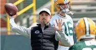  ?? MARK HOFFMAN / MILWAUKEE JOURNAL SENTINEL ?? Head coach Matt LaFleur throws a pass during Packers OTAs on May 24 in Green Bay.