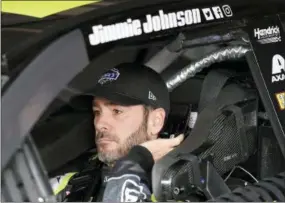 ?? NICK WASS — THE ASSOCIATED PRESS ?? Jimmie Johnson gets ready before practice for the NASCAR Cup series auto race, Saturday at Dover Internatio­nal Speedway in Dover, Del. Johnson is used to having the kind of milestones that have made him a surefire Hall of Famer. But his return to Dover...