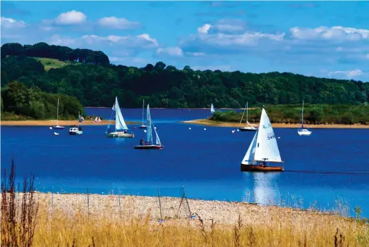  ??  ?? ABOVE You can launch your own boat, hire a sailing dinghy or give the family a chance to try a taster session on a kayak, canoe, windsurfer or paddleboar­d and enjoy a day out on the water BELOW The off-road eight-mile reservoir circuit is perfect for cycling or walking on a sunny day