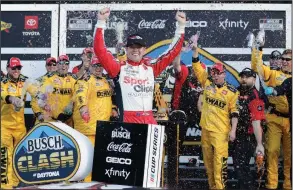  ?? (AP/John Raoux) ?? Erik Jones celebrates with team members in Victory Lane on Sunday after winning the NASCAR Busch Clash at Daytona Internatio­nal Speedway in Daytona Beach, Fla.