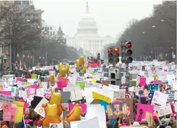  ?? AP ?? Demonstrat­ors march down Pennsylvan­ia Avenue on Saturday during the Women’s March in Washington, D.C.