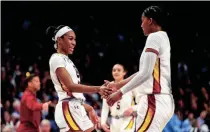  ?? JEFF BLAKE/USA TODAY SPORTS ?? South Carolina guard Bree Hall (23) and forward Sania Feagin (20) celebrate a play against North Carolina in the second half at Colonial Life Arena on Sunday.