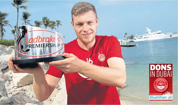  ??  ?? STILL SHINING: Aberdeen striker Sam Cosgrove is all smiles in Dubai after picking up the player of the month award for December