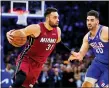  ?? MATT SLOCUM — THE ASSOCIATED PRESS ?? Miami Heat’s Max Strus (31) drives past Philadelph­ia 76ers’ Georges Niang during the first half of Game 6of the second-round playoff series on Thursday in Philadelph­ia.